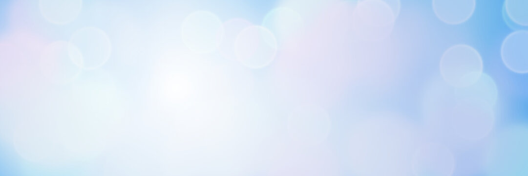 sunlit soft bokeh banner background in shades of blue 
