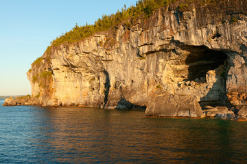 Fototapeta na wymiar Cliifs with Cave at Lakeshore