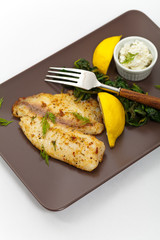 Baked Fish Fillet on white background. Selective focus.