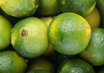Fresh ripe limes on wooden table