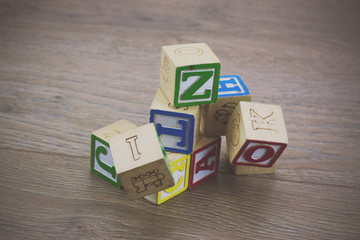 Childrens blocks on a wooden floor