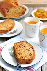 Vegan banana cake with raisins, dried cranberries and nuts.