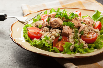 Tasty salad with couscous, tuna and vegetables