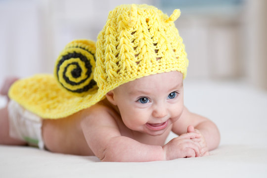 baby child in funny snail costume