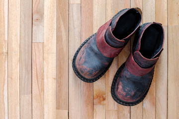 vintage boot on top of wooden