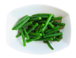 Green beans in a white plate, isolated, on white background