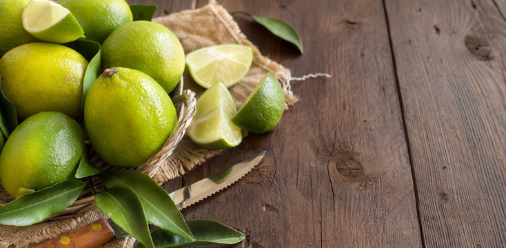 Fresh limes with knife