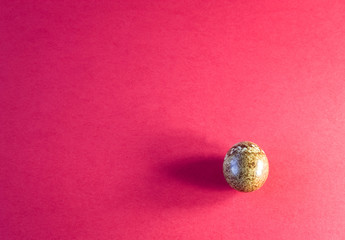 Qiail egg on red paper background
