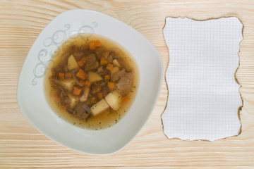 The menu for the restaurant on the tree with soup