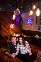 Fototapeta na wymiar Beautiful young couple in cafe
