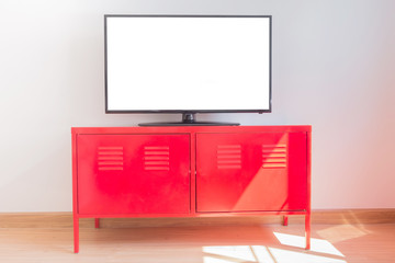 Led TV on TV stand on table and sunlight on a wall.Clipping path