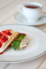 Belgian waffles with strawberry sauce