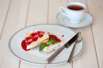 Belgian waffles with strawberry sauce