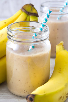 Banana smoothie on a wooden table
