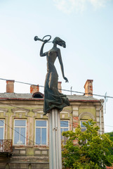 Statue of girl with horn in Kaunas