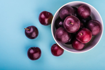 plums  on a blue  background
