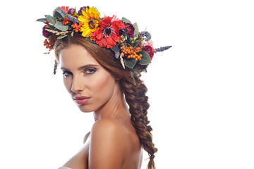 young beautiful woman portrait with wreath of flowers studio sho