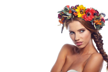Fototapeta na wymiar young beautiful woman portrait with wreath of flowers studio sho