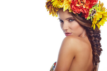 Fototapeta na wymiar young beautiful woman portrait with wreath of flowers studio sho