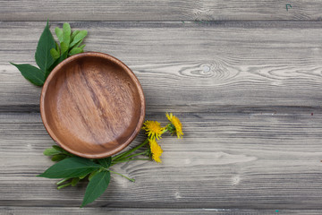 Top view empty plate on rustic wooden table  with spring leaf an