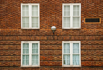 London, a traditional red bricks building with windows