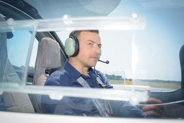 Side view of pilot in aircraft © auremar