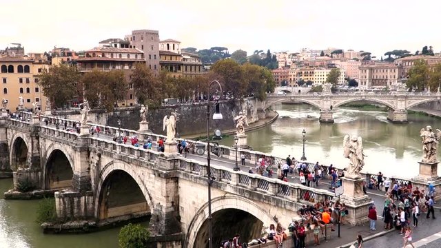 Bridge of Castel Sant'Angelo crowded with tourists, Rome Italy