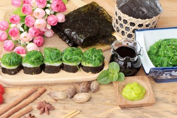 Sushi roll and seaweed salad is delicious.