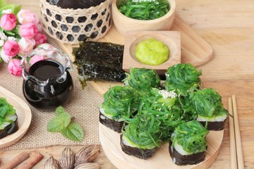 Sushi roll and seaweed salad is delicious.
