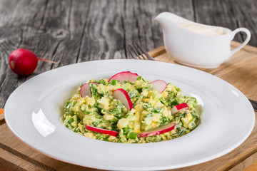 Spring onion, eggs, radish salad, close up
