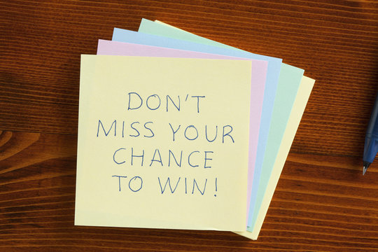 Don't Miss Your Chance To Win Written On A Note