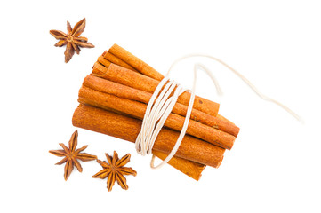 Cinnamon and anise on white background