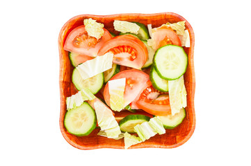 Vegetable salad in bowl on white background. Top view