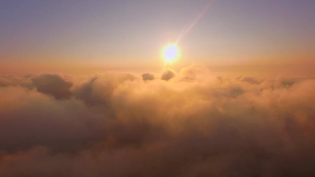 sun rising over cloudscape sky aerial view