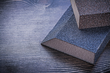 Sanding sponges on vintage wooden board abrasive tools