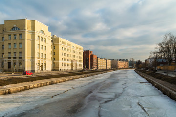 Fototapeta na wymiar View from the bridge over Pryazhka River and embankment, St. Petersburg, Russia.