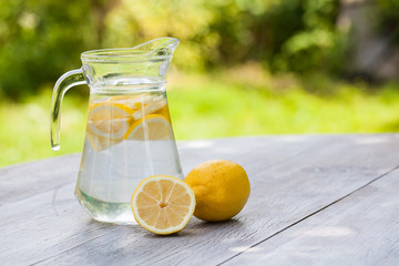 homemade citrus lemonade in pitcher with natural background