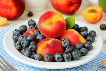Bowl of healthy fresh fruit salad apricots and blueberries
