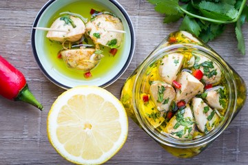 Marinated mozzarella in olive oil with chilli, coriander, parsle