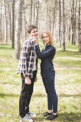 Fototapeta premium Young couple in love walking at the spring park