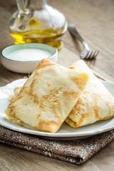 Pancakes, thin crepes stuffed with peas and bacon, to Russian Sh