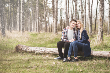 Naklejka na ściany i meble Close up portrait of attractive young couple outdoors