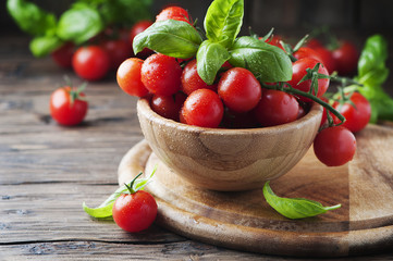 Fototapeta na wymiar Concept of vegetarian food with tomato and basil