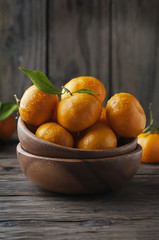 Sweet fresh orange mandarin on the wooden table