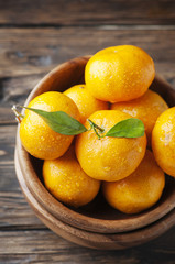 Sweet fresh tangerine on the wooden table