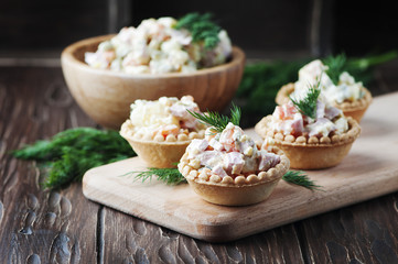 Traditional russian salad Olivier served in tartlet