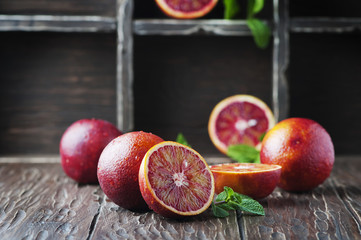 Red sweet oranges on the wooden table