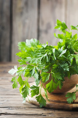 Fresh green parsley on the wooden table