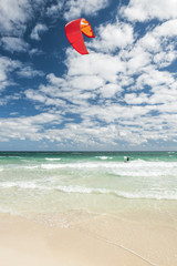 Fototapeta na wymiar kite surfer on a tropical beach