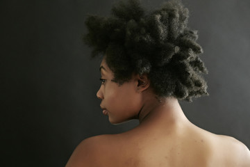 Close up of black woman looking over shoulder